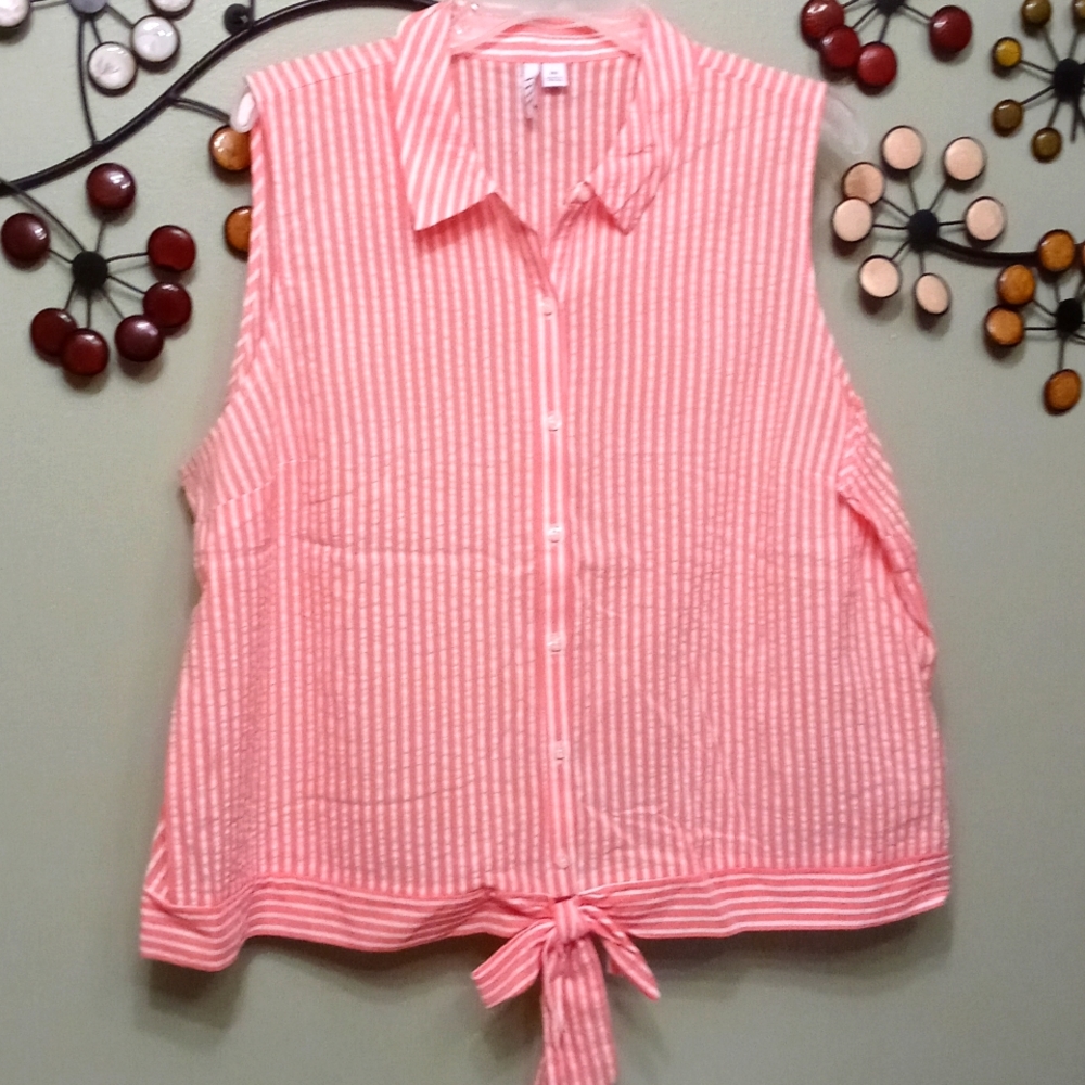 Women's sleeveless button up shirt with tie in front bottom.
